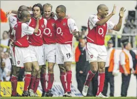  ?? Photo: Odd Andersen/afp ?? The Invincible­s (no more): Arsenal’s Thierry Henry (right) celebrates the Gunners win. But the tide has turned.