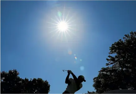  ?? GETTY IMAGES ?? Tiger Woods plays his shot from the 14th tee during a practice round for the PGA Championsh­ip.