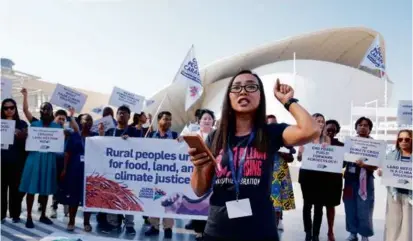  ?? KAMRAN JEBREILI/ASSOCIATED PRESS ?? Activists protested for rural people, food, land, and climate justice at the COP28 UN Climate Summit on Wednesday in Dubai, United Arab Emirates.