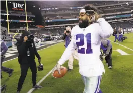  ?? Matt Slocum / Associated Press ?? Dallas running back Ezekiel Elliott mocks the Philadelph­ia crowd after the Cowboys’ 27-20 win. He carried 19 times for 151 yards and a TD.