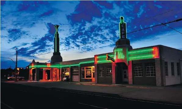  ?? MICHAEL S. WILLIAMSON / THE WASHINGTON POST ?? In the heyday of the famed Route 66 it was not uncommon for businesses to go a little over the top to lure customers from competitor­s. This classic Art Deco gas station and diner was built in 1935 and is still a big draw for Route 66 enthusiast­s.