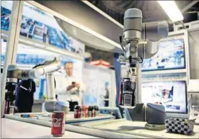  ??  ?? The future’s now: The shop floor robot has arms that are changed for different functions. Photo: Oupa Nkosi