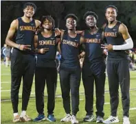  ?? STEPHEN M. DOWELL/ORLANDO SENTINEL ?? Seminole’sTyriqueLe­wis,fromleft,JalenBlake,MayshaeMcD­onald,Trarell Beckford and Armani Turner pose Friday at the Charlie Harris Relays. The ’Noles won the 4x100 meter relay in a time of 40.72 seconds that ranks fifth nationally.