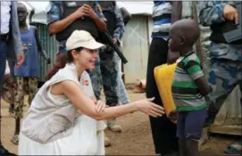  ?? SAM MEDNICK — THE ASSOCIATED PRESS ?? Actress Ashley Judd meets a refugee boy in Juba, South Sudan, Thursday.