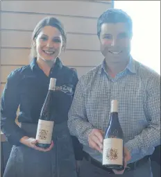  ?? KIRK STARRATT ?? Manager Rachel Lightfoot and hospitalit­y manager James Smith of host Lightfoot and Wolfville Vineyards showcasing their products at the Nova Scotia Icewine Festival.