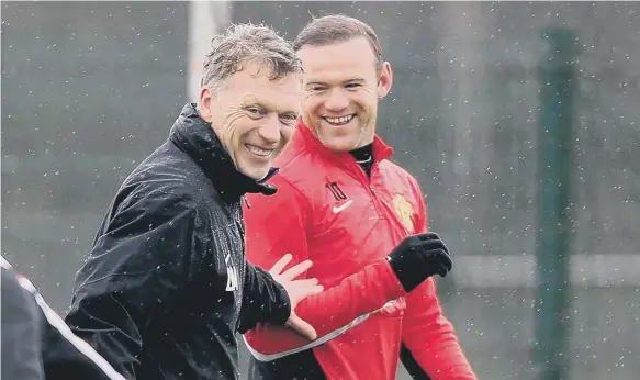  ??  ?? David Moyed shares a joke with Wayne Rooney during his short stay in the Old Trafford hot-seat