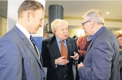  ?? KEITH GOSSE FILE PHOTO • THE TELEGRAM ?? Former politician and fisheries union leader Richard Cashin (centre) speaks with former Fish, Food and Allied Workers union president Earle Mccurdy (right) and former FFAW president Keith Sullivan (left) on Sept. 29, 2017.