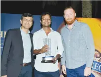  ??  ?? IGS’ ‘Race to Scotland’ winner Gaurav Verma celebrates with the trophy after his victroy at the Emirates Golf Club.