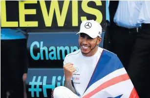  ?? Picture: GETTY IMAGES/AFP/DAN ISTITENE ?? JOINING ELITE LEAGUE: Fourth place finisher Lewis Hamilton celebrates winning the 2018 F1 World Drivers Championsh­ip with his team after the Formula One Grand Prix of Mexico on Sunday.