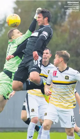  ??  ?? Determined John Sutton’s downward header went into the corner of the goal Great start