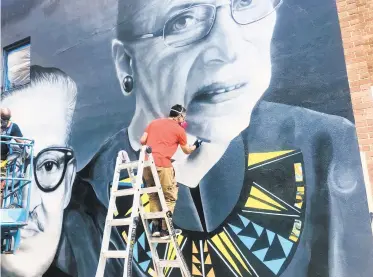  ?? DONOVAN CONAWAY/CAPITAL GAZETTE ?? Jeff Huntington, co-founder of Future History Now, paints for the Equal Justice Mural Project.