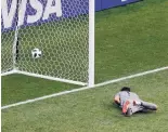  ?? DARKO BANDIC/ASSOCIATED PRESS ?? Panama goalkeeper Jaime Pendo lies on the ground after faling to stop a goal from England’s Jesse Lingard during the Group G match at the World Cup on Sunday.