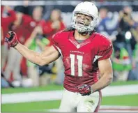  ?? AP PHOTO ?? Arizona Cardinals wide receiver Larry Fitzgerald (11) celebrates his catch in the red zone to set up a game winning touchdown against the Green Bay Packers during the second half of an NFL divisional playoff game, Saturday in Glendale, Ariz. The...