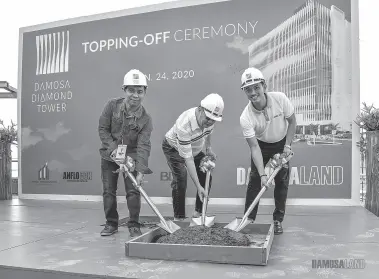  ??  ?? PHOTO shows during the topping of the Damosa Land Inc.’s Diamond Tower are (from left) Christian Cambaya, Davao City Investment Promotion Center Investor and Servicing Unit head; Willy Ho, Carwill president; and, Ricardo F. Lagdameo, DLI first vice president.