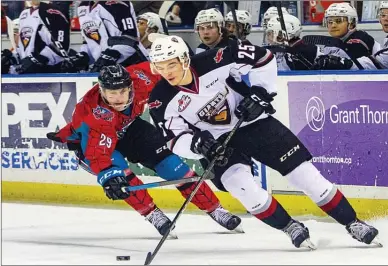  ?? ANDREW KNOPF/Special to The Daily Courier ?? Kaleb Bulych (25) of Vancouver Giants is shadowed by Kelowna Rocket Nolan Foote (29) during Western Hockey League action, Saturday at Prospera Place. With a 3-2 overtime win, Kelowna will play a single-game playoff against Kamloops Blazers (which had the better head-to-head record),Tuesday in Kamloops.