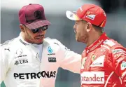  ?? /Getty Images ?? That was then: Lewis Hamilton and Sebastian Vettel on friendlier terms before the bust-up in Baku.