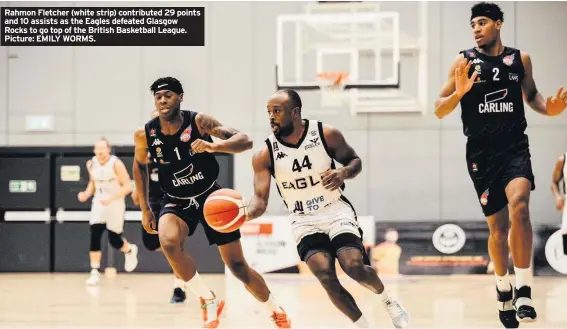  ??  ?? Rahmon Fletcher (white strip) contribute­d 29 points and 10 assists as the Eagles defeated Glasgow Rocks to go top of the British Basketball League. Picture: EMILY WORMS.