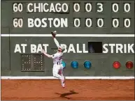  ?? Winslow Townson / Getty Images ?? The Red Sox’s Alex Verdugo can’t catch this hit by the White Sox’s Yasmani Grandal on Sunday.