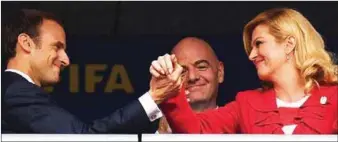  ??  ?? President of France, Emmanuel Macron (left) and his Croatian counterpar­t, Andrej Plenkovic in warm greetings before the match while the FIFA President, Gianni Infantino watches with keen interest last night