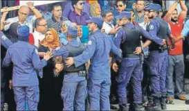  ?? AP ?? ▪ Maldivian police officers push back supporters of the opposition during a protest demanding the release of jailed lawmakers in Male on February 9, 2018.