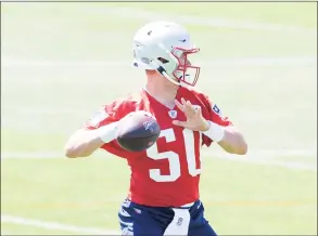  ?? Kathryn Riley / Getty Images ?? The Patriots’ Mac Jones looks to complete a pass during mandatory minicamp in June.