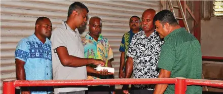  ?? ?? Assistant Minister in the Office of the Prime Minister, Sakiusa Tubuna, being briefed on the operations of the Fiji Rice Limited Dreketi Mill on January 7, 2023.