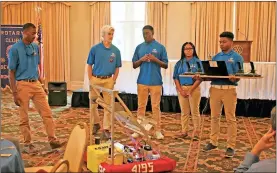  ?? / Spencer Lahr ?? Earlier this year, Boys &amp; Girls Club robotics team members Ronald Johnson (from left), Nathaniel Johnstone, Cameron Johnson, Aja Morgan and Jaden Roberts talk to the Rome Seven Hills Rotary Club about their robotics team.