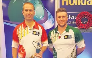  ??  ?? Top man EK’s Kieran Clinton, left, with the Masters trophy alongside runner-up Colin Walker