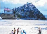  ??  ?? Elephant Rock is unchanged, but the surf lifesaving club has definitely had a facelift.