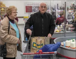  ?? Shoppers Alice Evans and Tony Sheehan availed of the earlier time slots on Saturday for get the groceries. Photos by Domnick Walsh ??