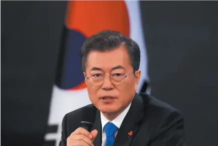  ?? AP PHOTO ?? South Korean President Moon Jae-in answers reporters’ questions during a news conference at the Presidenti­al Blue House in Seoul, South Korea, on Wednesday.
