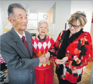  ?? JOHN MAHONEY ?? Neighbour Audette Lavoie gets emotional listening to 96-year-old Park Yong Jung, wife of 100-year-old Yeo Choon Sung, sing a song in Korean in their apartment in Notre-Dame-de-Grâce this week. Lavoie has become a close friend to the couple, who moved...