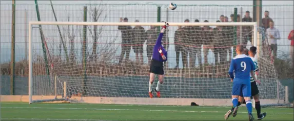  ??  ?? Greystones goalkeeper Adam Hayden makes a late fingertip save to earn Greystones a replay in the FAI Intermedia­te Cup semi-final with Cobh Wanderers.