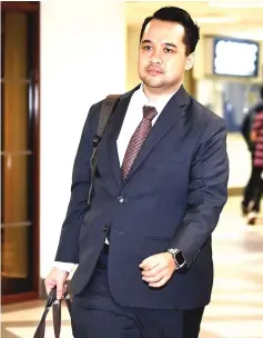  ?? — Bernama photo ?? Ahmad Farhan arrives at the High ��ourt for Najib’s SR�� Internatio­nal Sdn Bhd’s trial.