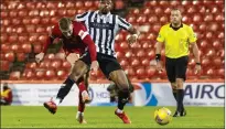  ??  ?? Lewis Ferguson notches the winning goal for Aberdeen