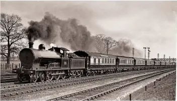  ?? F E MACKAY/RM ARCHIVE ?? Right: LNWR ‘Prince of Wales’ class No. 979
W M Thackeray heads the 2pm ‘Scotch Express’ corridor train near Harrow & Wealdstone in April 1914.