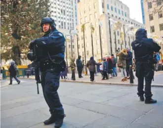  ?? Bebeto Matthews, The Associated Press ?? Police are reinforcin­g Christmas markets around New York, above, and other American cities in the wake of Monday’s attack in Berlin.