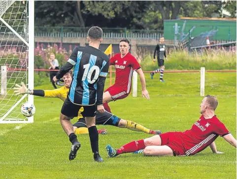  ??  ?? Action from Broughty Athletic’s (red) EoS Cup tie against East Craigie at Whitton Park. The Shipbuilde­rs won 4-1.