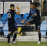  ?? NHAT V. MEYER — STAFF PHOTOGRAPH­ER ?? Chris Wondolowsk­i, right, celebrates a goal with Cristian Espinoza last year. Both are expected to play vital roles with Quakes in 2021.