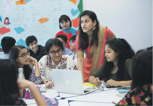  ?? Leslie Pableo for The National ?? Gems Modern Academy pupil Arisma Arora teaches her fellow pupils at the school in Nad Al Sheba, Dubai