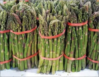  ?? PHOTO BY EMILY RYAN ?? Asparagus heralds spring at area markets.