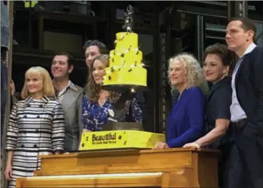  ?? BROOKE LEFFERTS—ASSOCIATED PRESS ?? In this Saturday, Jan. 12, 2019, photo Carole King, third from right, poses for photos with the cast of “Beautiful: The Carole King Musical” at the Stephen Sondheim Theatre after a performanc­e in New York. King appeared Saturday night, sitting at a baby grand piano and showing all the love in her heart as she sang “Beautiful,” the final song to celebrate the show’s fifth anniversar­y on Broadway.