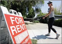  ??  ?? In this file photo, a woman walks next to a ‘For Rent’ sign at an apartment complex in Palo Alto, Calif. Many tenants aren’t familiar with the ins and outs of their renters insurance policies, but what they don’t know could cost
them money. (AP)