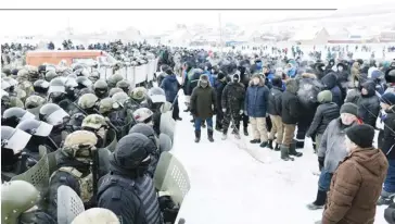  ?? ANYA MARCHENKOV­A/AGENCE FRANCE-PRESSE ?? RIOT policemen face off with protesters after a court sentenced a local activist to four years in prison, in the town of Baymak in Russia’s central Bashkortos­tan region. Fail Alsynov, who campaigns against gold mining in the Urals region and advocates for the protection of the large ethnic Bashkir population’s language, was sentenced for ‘inciting hatred’ in the town.