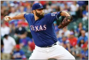  ?? AP/JEFFREY MCWHORTER ?? Texas Rangers starter Lance Lynn matched his season high with 11 strikeouts in seven strong innings for his major league-best 12th victory in a 5-0 victory over the Houston Astros on Thursday in Arlington, Texas.