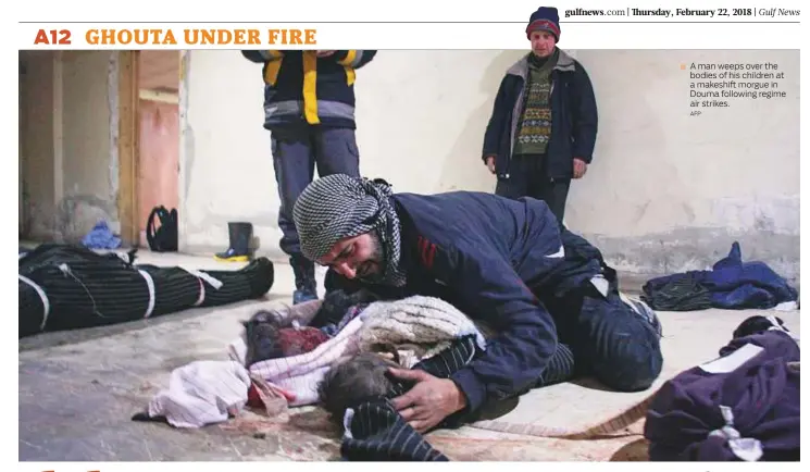  ?? AFP ?? ■ A man weeps over the bodies of his children at a makeshift morgue in Douma following regime air strikes.