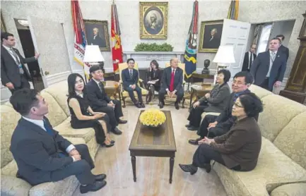  ?? Zach Gibson, Getty Images ?? President Donald Trump meets with North Korean defectors in the Oval Office of the White House in Washington on Friday. Trump’s meeting came one week before the start of the Winter Olympics in PyeongChan­g, a South Korean city. North Korea will be...