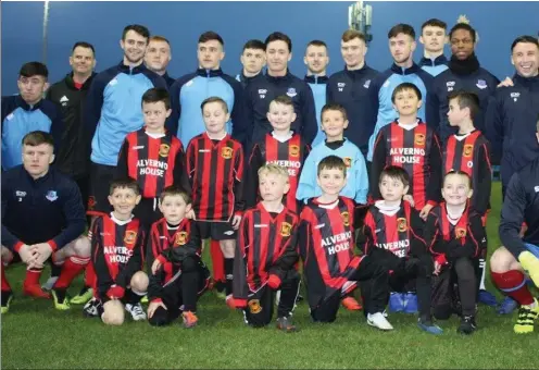  ??  ?? Laytown United Under-8s pictured with the Drogheda United squad before the recent league match against Wexford.