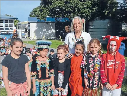  ?? Heather Haswell and Paremata School pupils dressed up to raise money for a Ugandan school in need. From left, Ava Sao, Aimee Keokotavon­g, Isabella Katene, Macy Pau’u, Danielle Rule and Cameron Whale. Photo: SOPHIE LEGGETT ?? Cultural day: