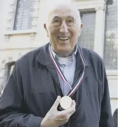  ??  ?? 0 Jean Vanier poses for a photograph after receiving the Templeton Prize at St Martins-in-the-fields church in London